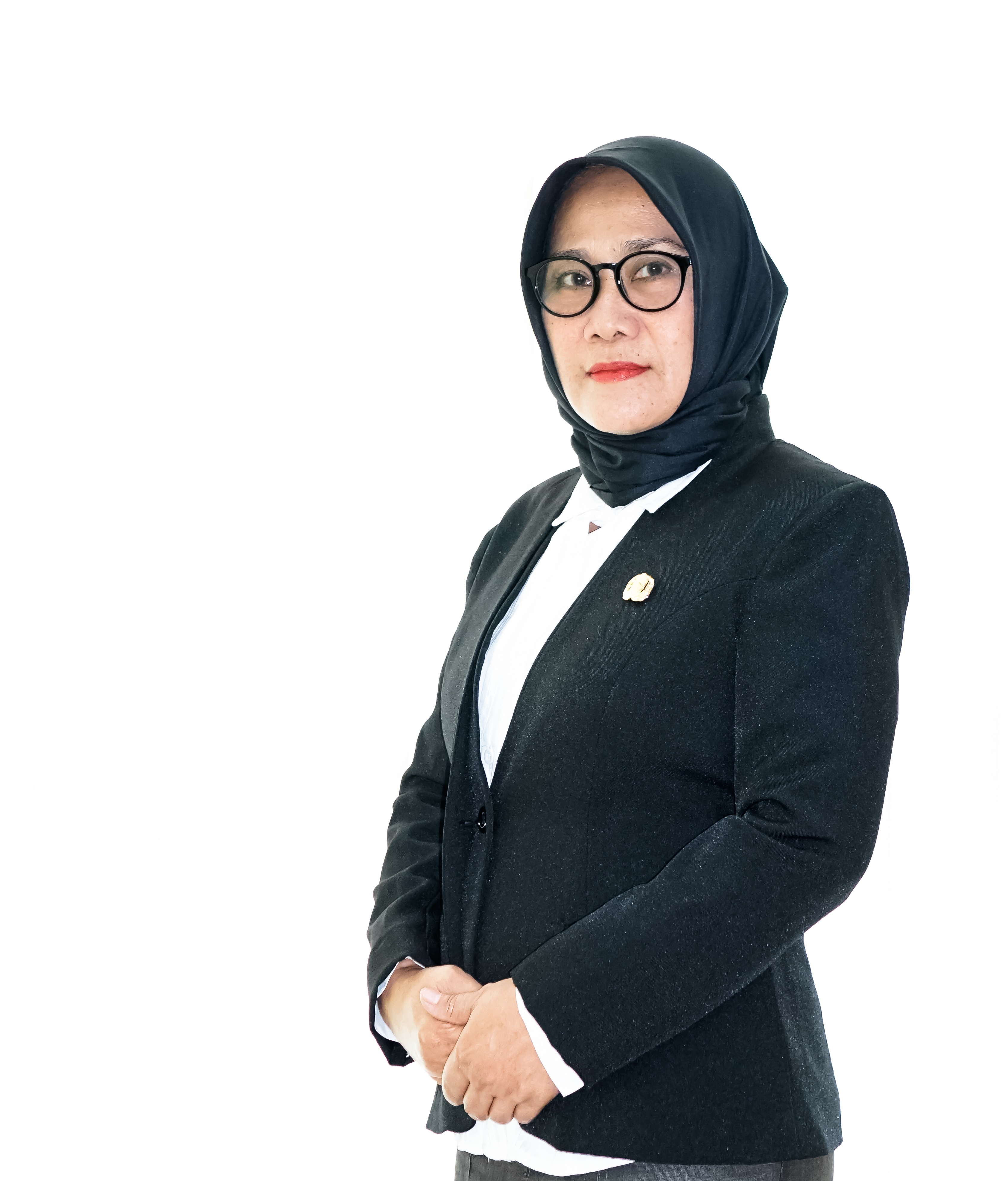 Dra.  SITI HASANAH